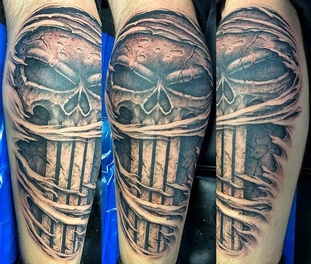 Punisher Skull logo calf tattoo
